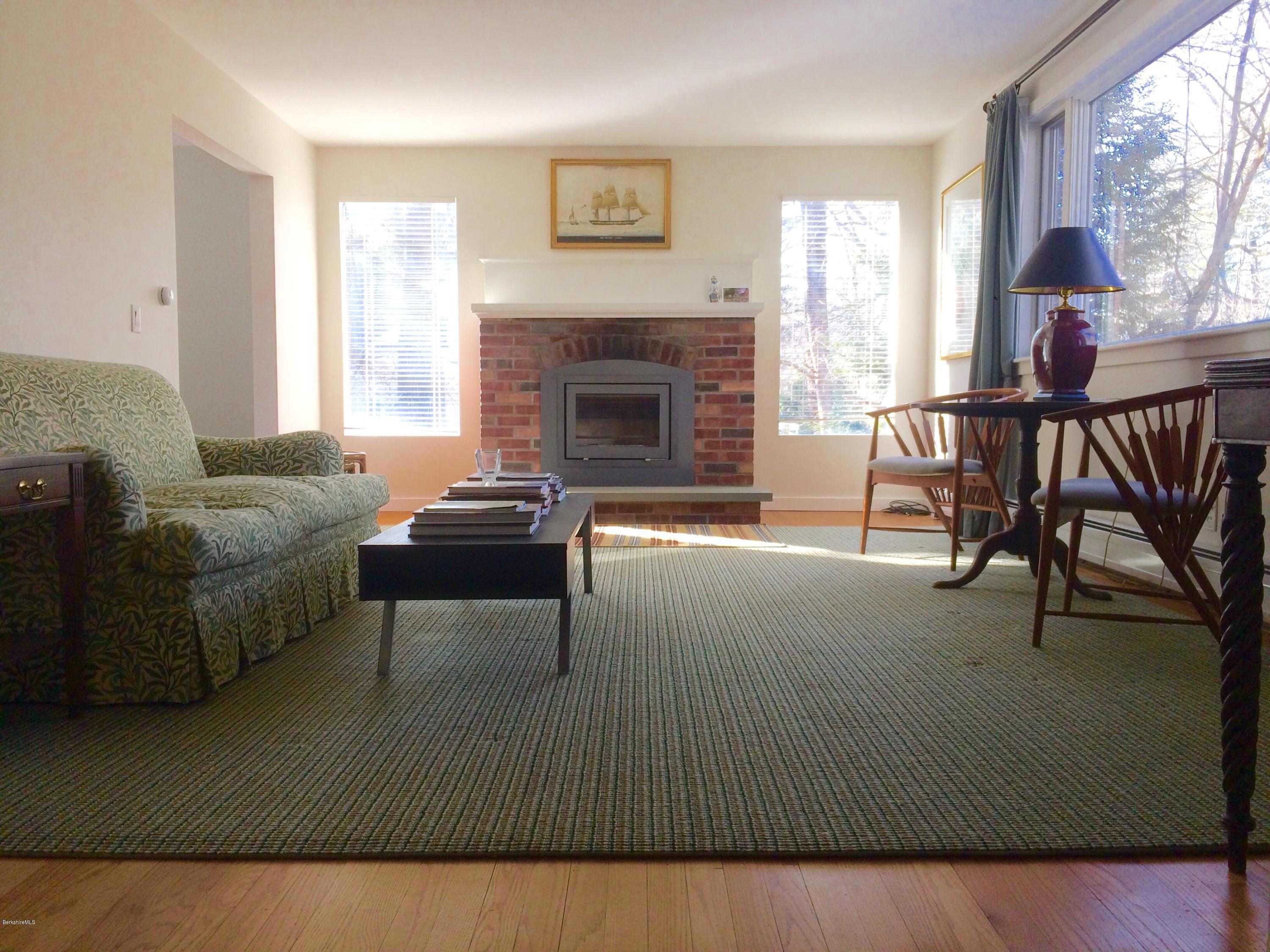 5 Hawthorne Road Lenox, MA 01240 - Photo 3 of 18 a living room with furniture and a fireplace