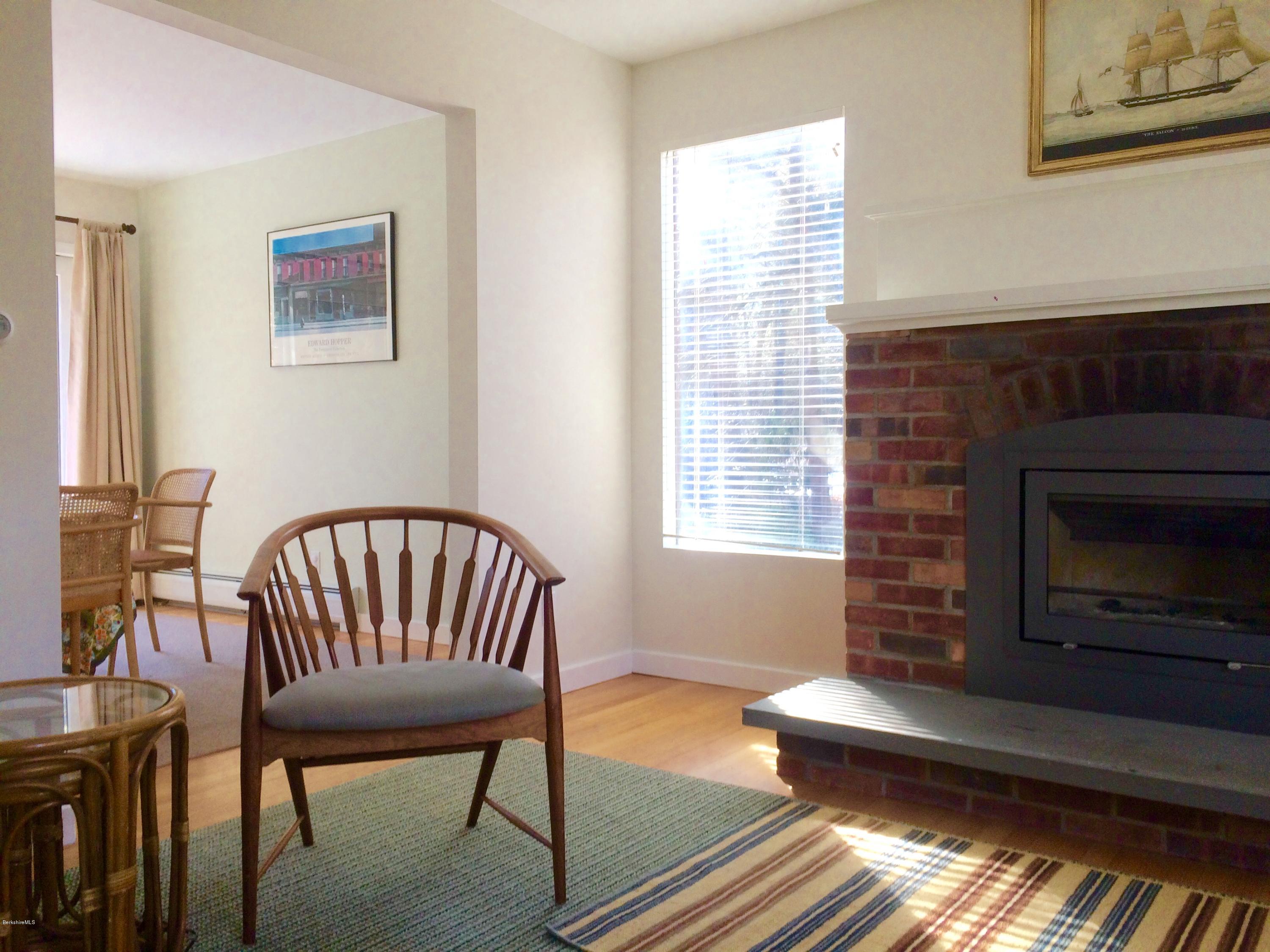 5 Hawthorne Road Lenox, MA 01240 - Photo 5 of 18 a living room with furniture a fireplace and a window