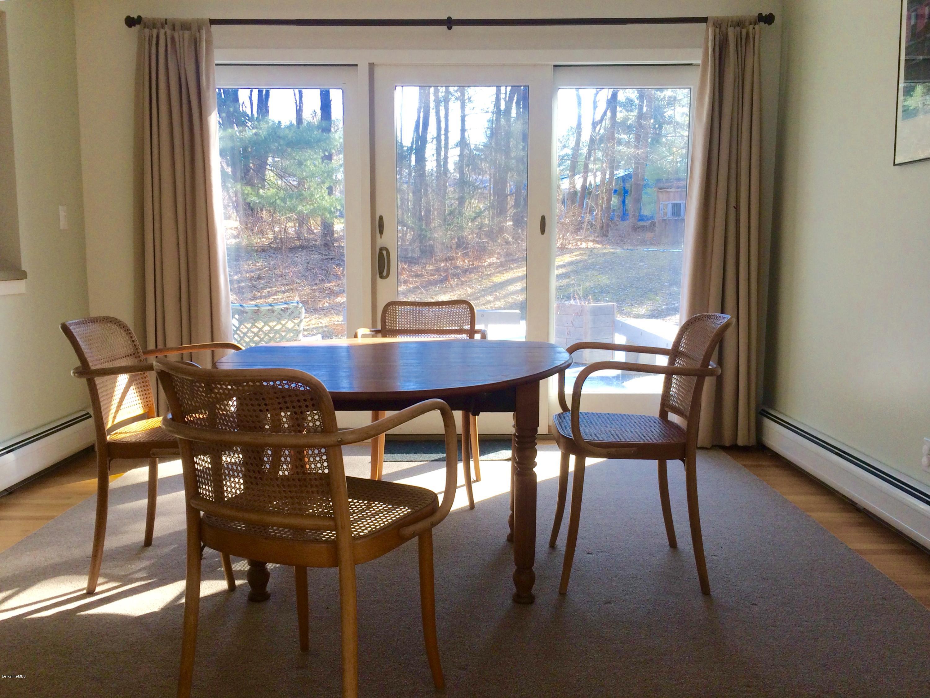 5 Hawthorne Road Lenox, MA 01240 - Photo 6 of 18 a view of a dining room with furniture and a window