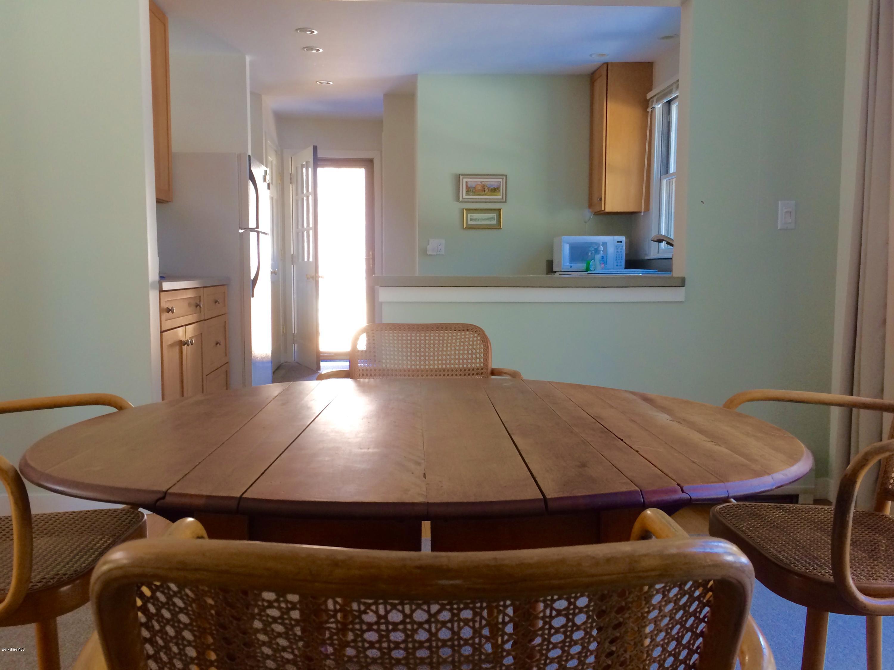 5 Hawthorne Road Lenox, MA 01240 - Photo 7 of 18 a view of a balcony and dining room