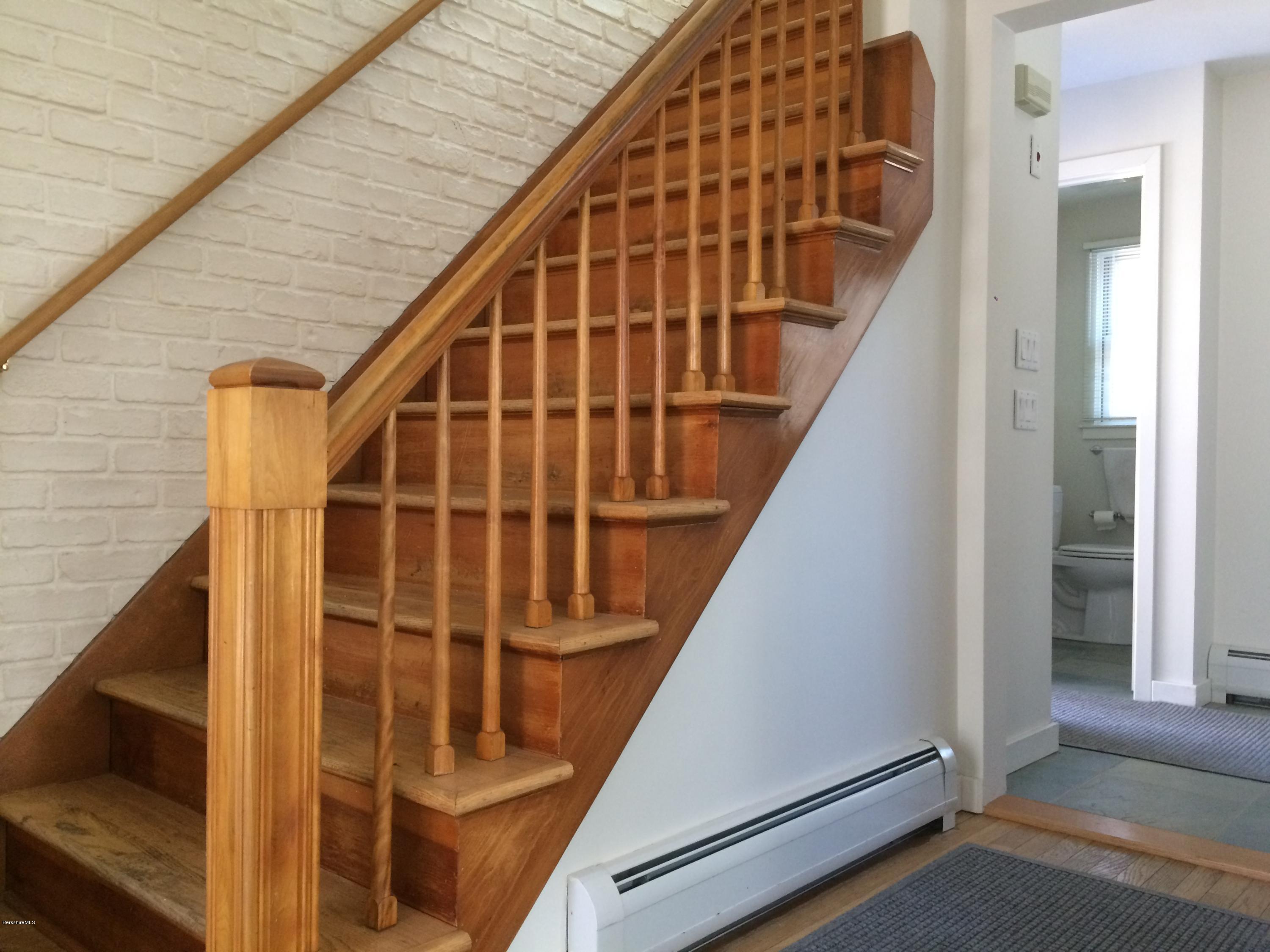 5 Hawthorne Road Lenox, MA 01240 - Photo 10 of 18 a view of staircase with railing and white walls