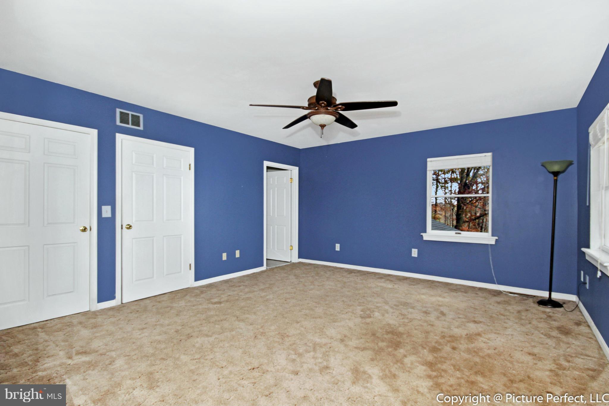4911 Sundown Road Laytonsville, MD 20882 - Photo 18 of 21 a view of a livingroom with a ceiling fan
