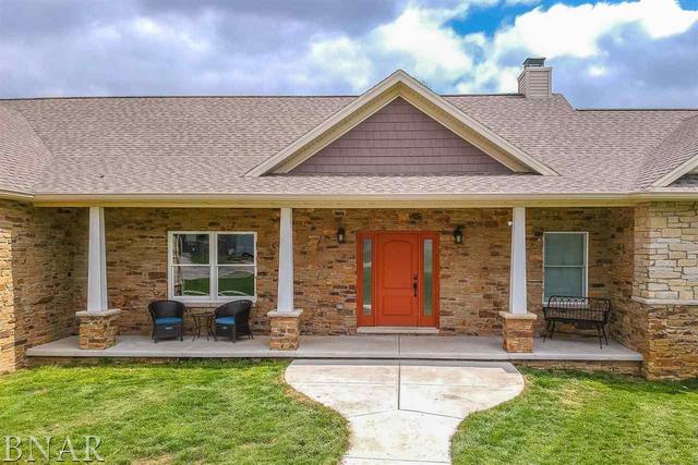 6286 Park Road Clinton, IL 61727 - Photo 2 of 45 a front view of a house with swimming pool and porch with furniture