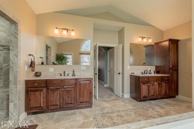 6286 Park Road Clinton, IL 61727 - Photo 13 of 45 a spacious bathroom with a bathtub sink and double vanity