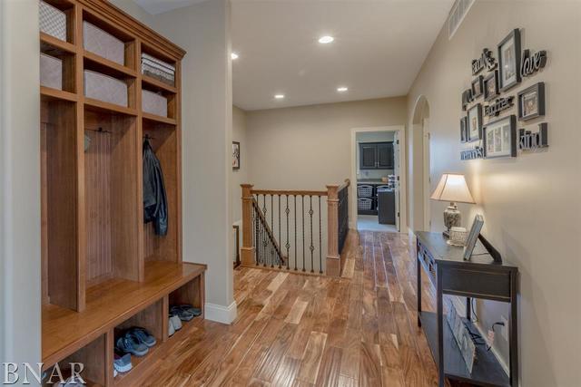 6286 Park Road Clinton, IL 61727 - Photo 16 of 45 a view of a hallway with wooden floor and staircase