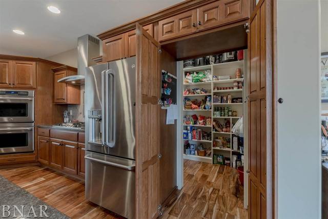 6286 Park Road Clinton, IL 61727 - Photo 3 of 45 a kitchen with stainless steel appliances a refrigerator and a stove top oven