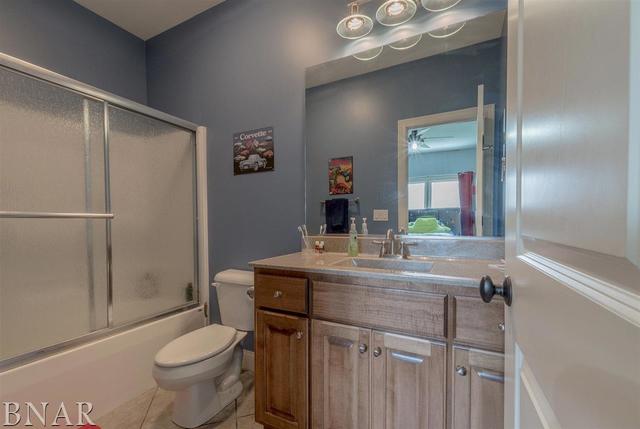 6286 Park Road Clinton, IL 61727 - Photo 21 of 45 a bathroom with a granite countertop sink toilet and shower