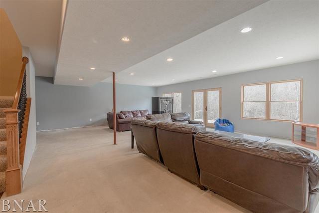 6286 Park Road Clinton, IL 61727 - Photo 22 of 45 a living room with stainless steel appliances kitchen island granite countertop furniture and a large window