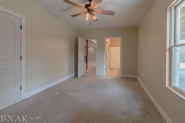 6286 Park Road Clinton, IL 61727 - Photo 24 of 45 a view of a livingroom with a ceiling fan and window