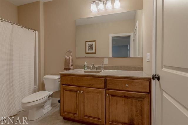 6286 Park Road Clinton, IL 61727 - Photo 25 of 45 a bathroom with a toilet a sink and a mirror