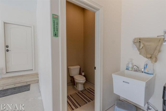 6286 Park Road Clinton, IL 61727 - Photo 30 of 45 a bathroom with a sink and a toilet