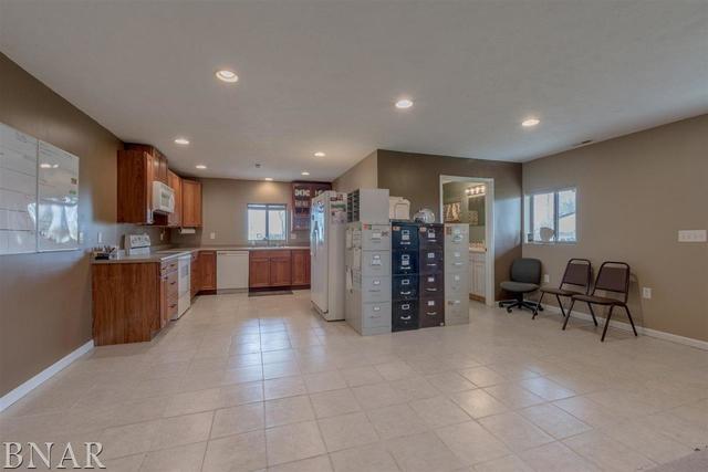 6286 Park Road Clinton, IL 61727 - Photo 40 of 45 a kitchen with stainless steel appliances a refrigerator and a wooden cabinets