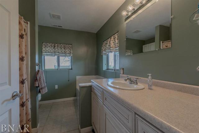 6286 Park Road Clinton, IL 61727 - Photo 41 of 45 a bathroom with a sink and a mirror