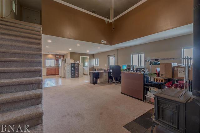 6286 Park Road Clinton, IL 61727 - Photo 42 of 45 a living room with furniture and a flat screen tv