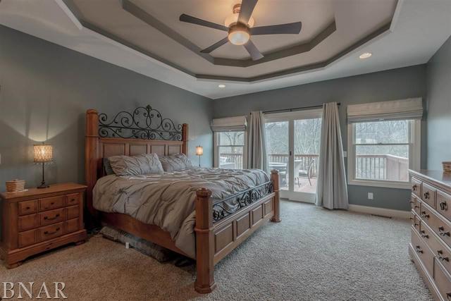 6286 Park Road Clinton, IL 61727 - Photo 10 of 45 a bed sitting in a spacious bedroom next to a window