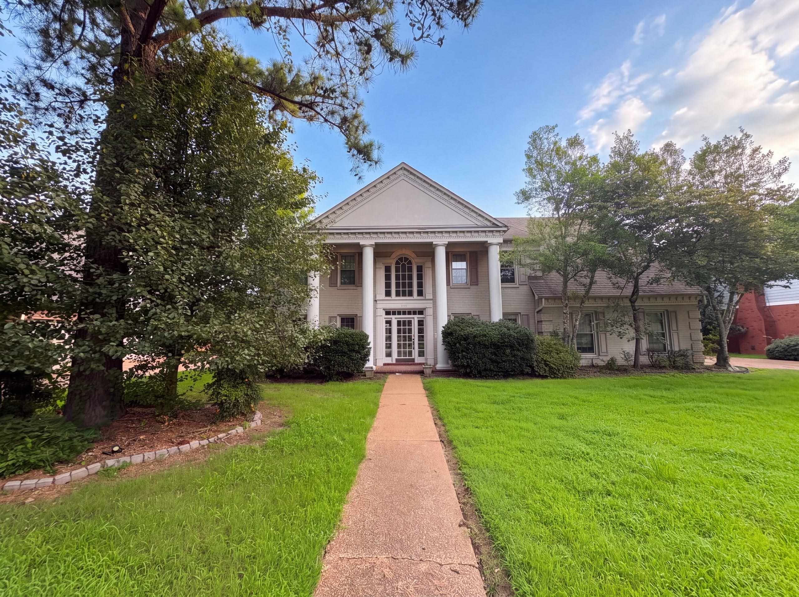 9424 Gotten Road Germantown, TN 38139 - Photo 1 of 27 Stately Colonial-style residence featuring a prominent portico with four Doric columns