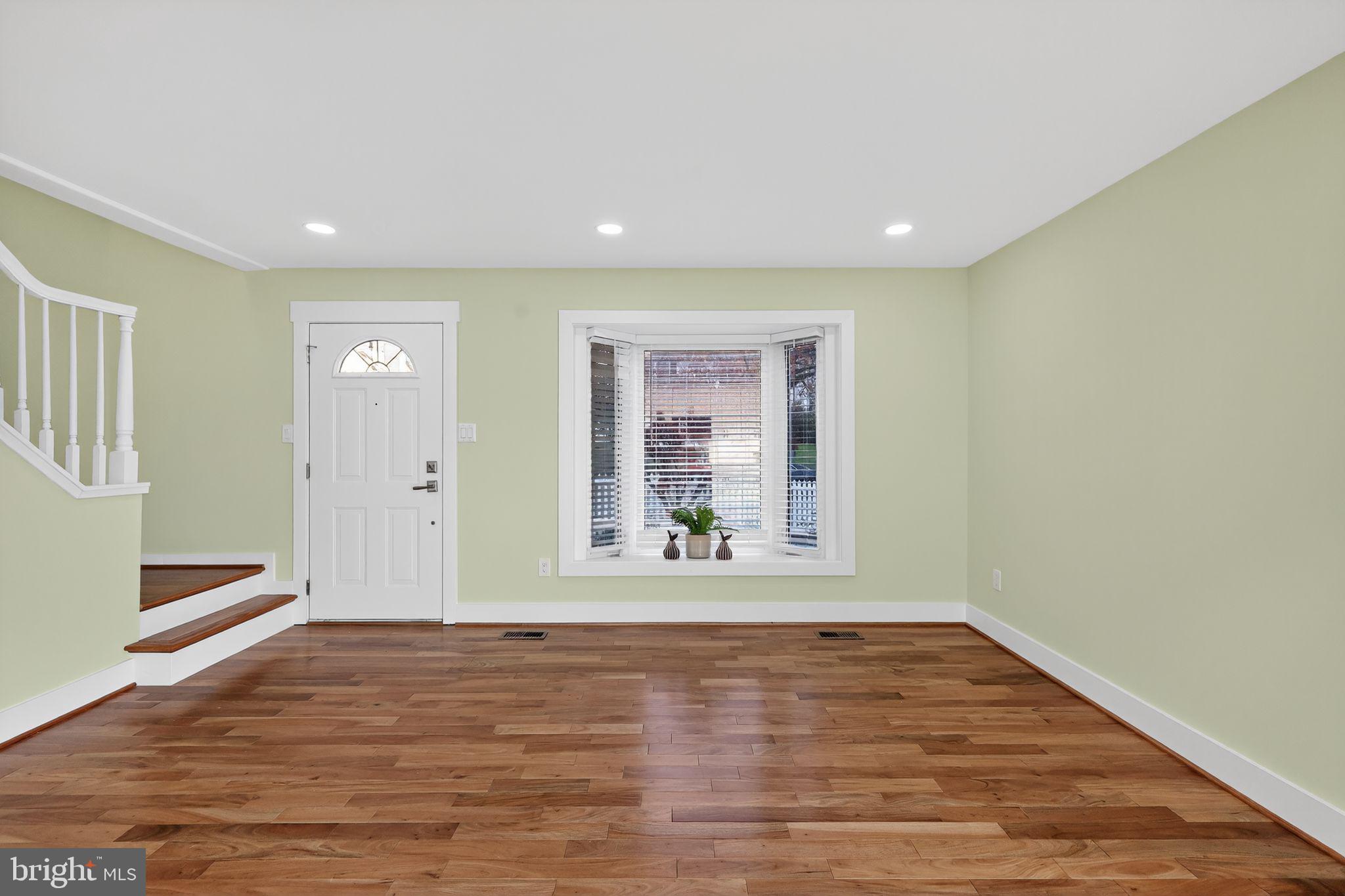 1943 South Lowell Street Arlington, VA 22204 - Photo 11 of 29 a view of an empty room with wooden floor and a window