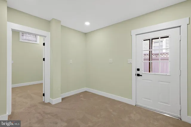 a view of an empty room with stairs