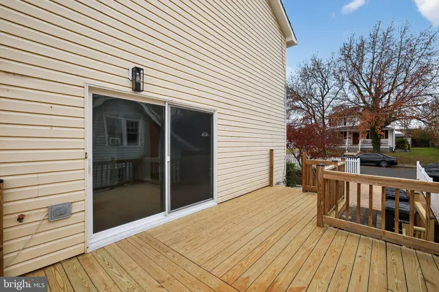 a view of a balcony with wooden floor