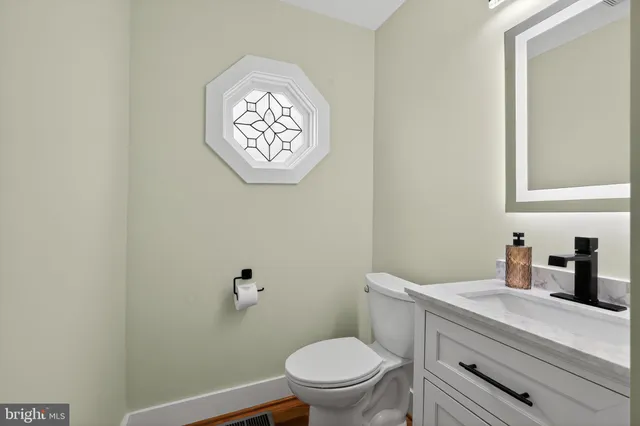 a bathroom with a toilet and a sink