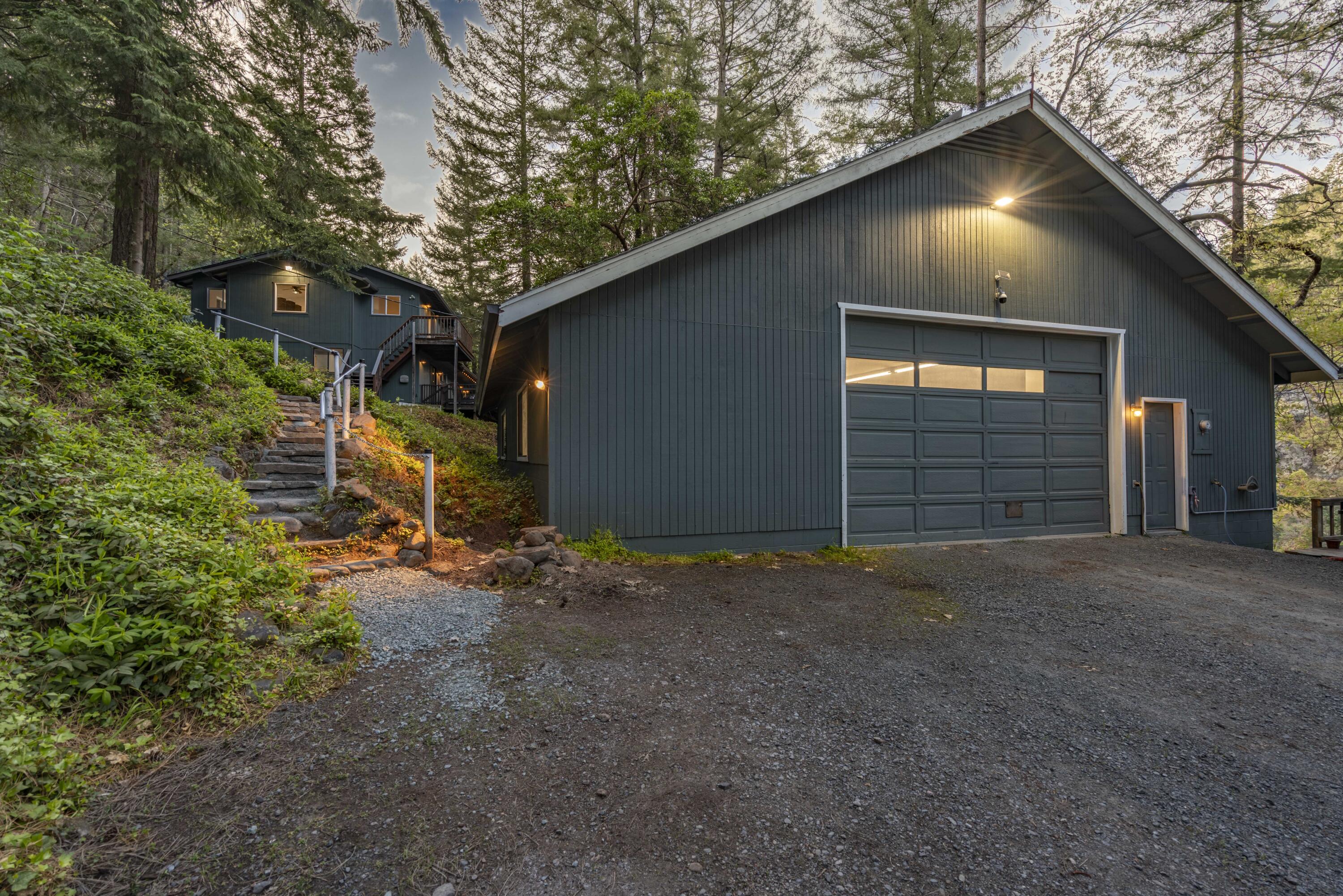 11744 Galice Road Merlin, OR 97532 - Photo 69 of 74 a view of a house with a yard and garage