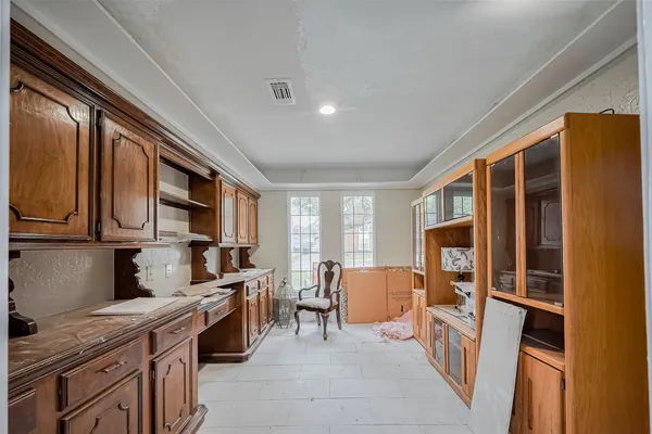 a kitchen with stainless steel appliances granite countertop a refrigerator and wooden cabinets
