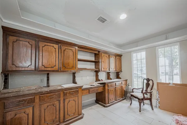 a kitchen with a sink cabinets and window