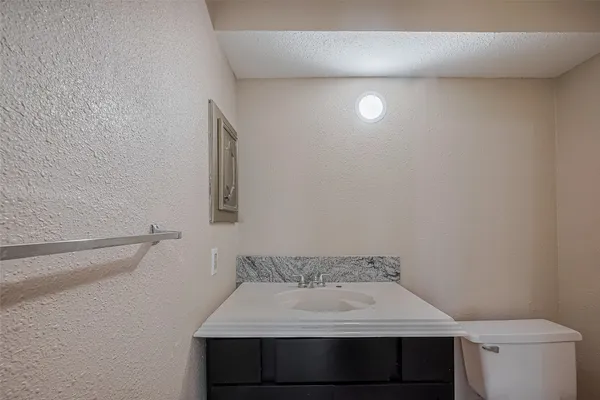 a bathroom with a sink and a toilet