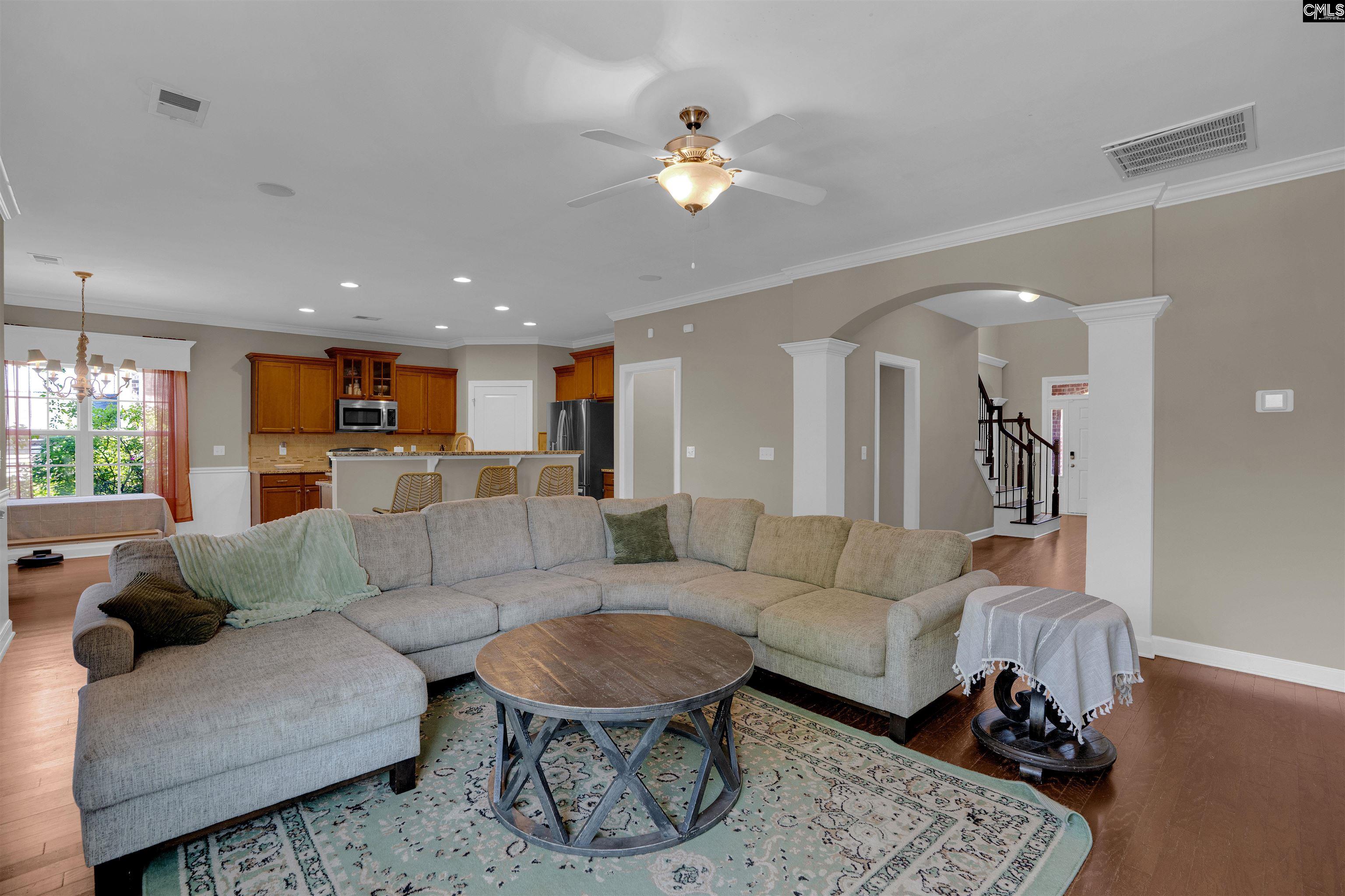 321 Asa Rose Lexington, SC 29072 - Photo 17 of 52 a living room with furniture and a chandelier