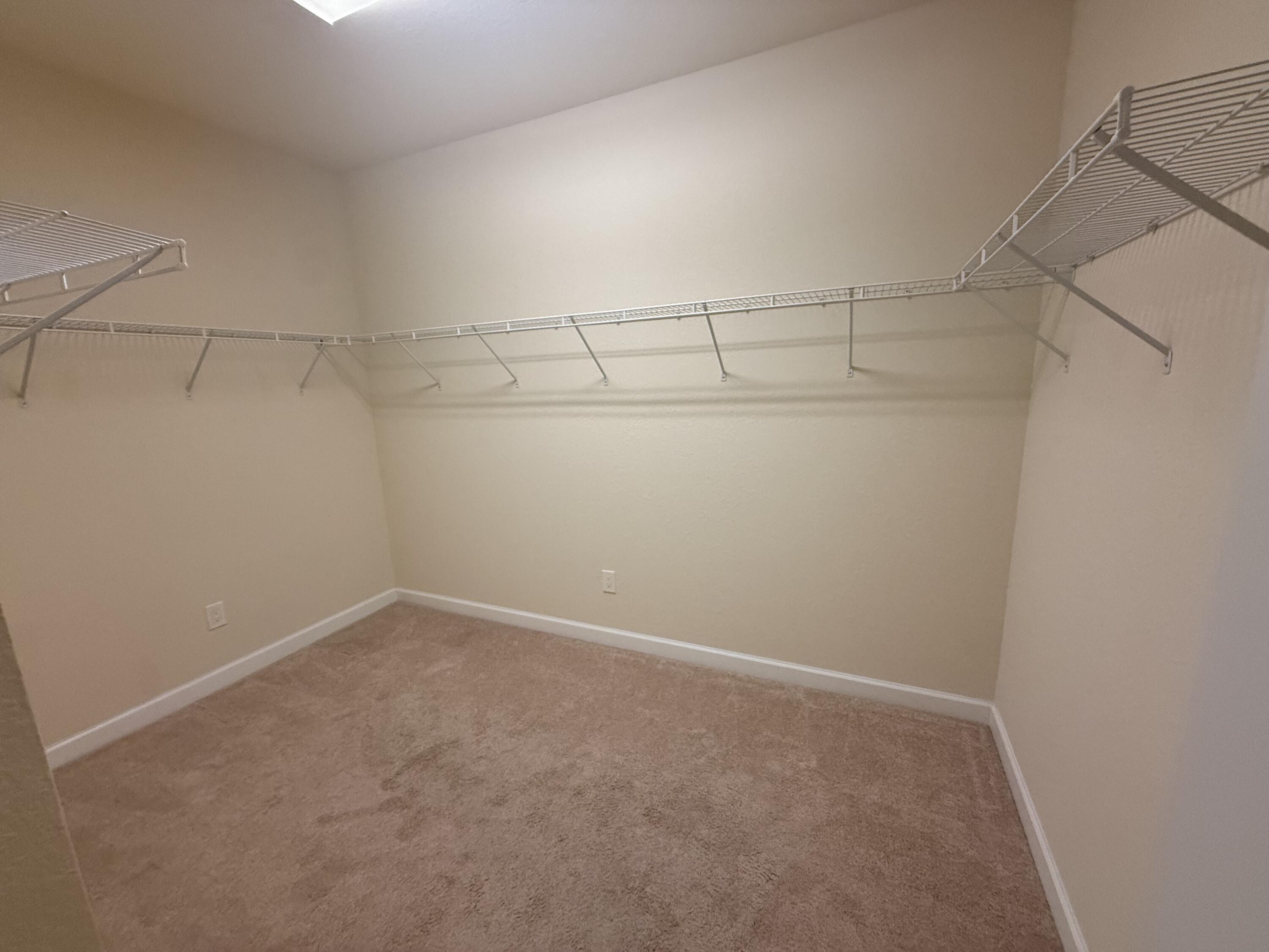 148 Northwest Emerson Place Boca Raton, FL 33432 - Photo 21 of 44 Primary Walk-in Closet