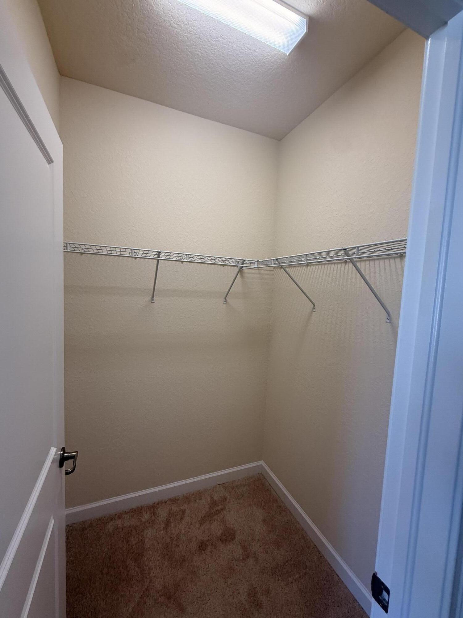 148 Northwest Emerson Place Boca Raton, FL 33432 - Photo 30 of 44 Back Bedroom Walk-in Closet