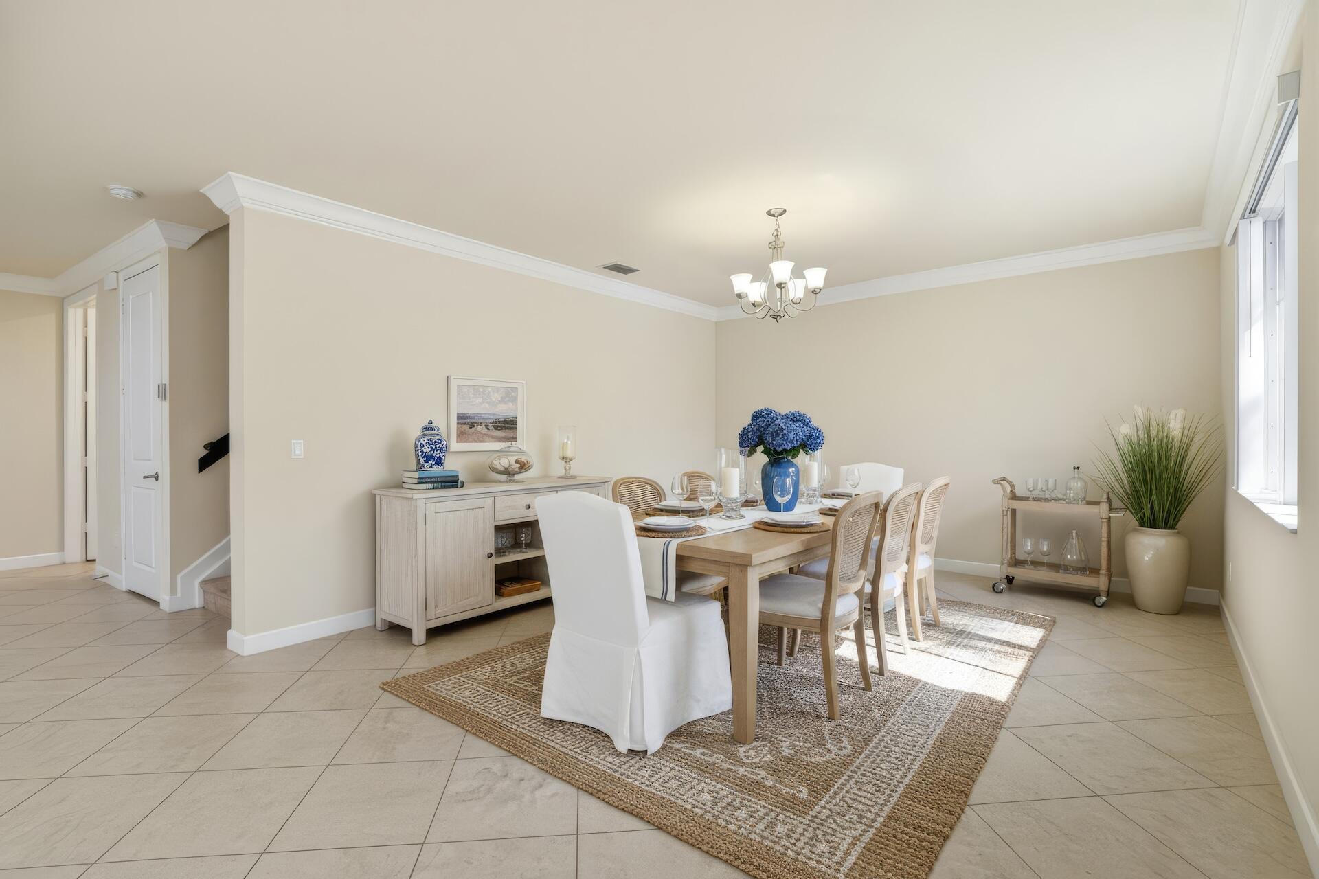 148 Northwest Emerson Place Boca Raton, FL 33432 - Photo 5 of 44 Photo Staged Dining Room