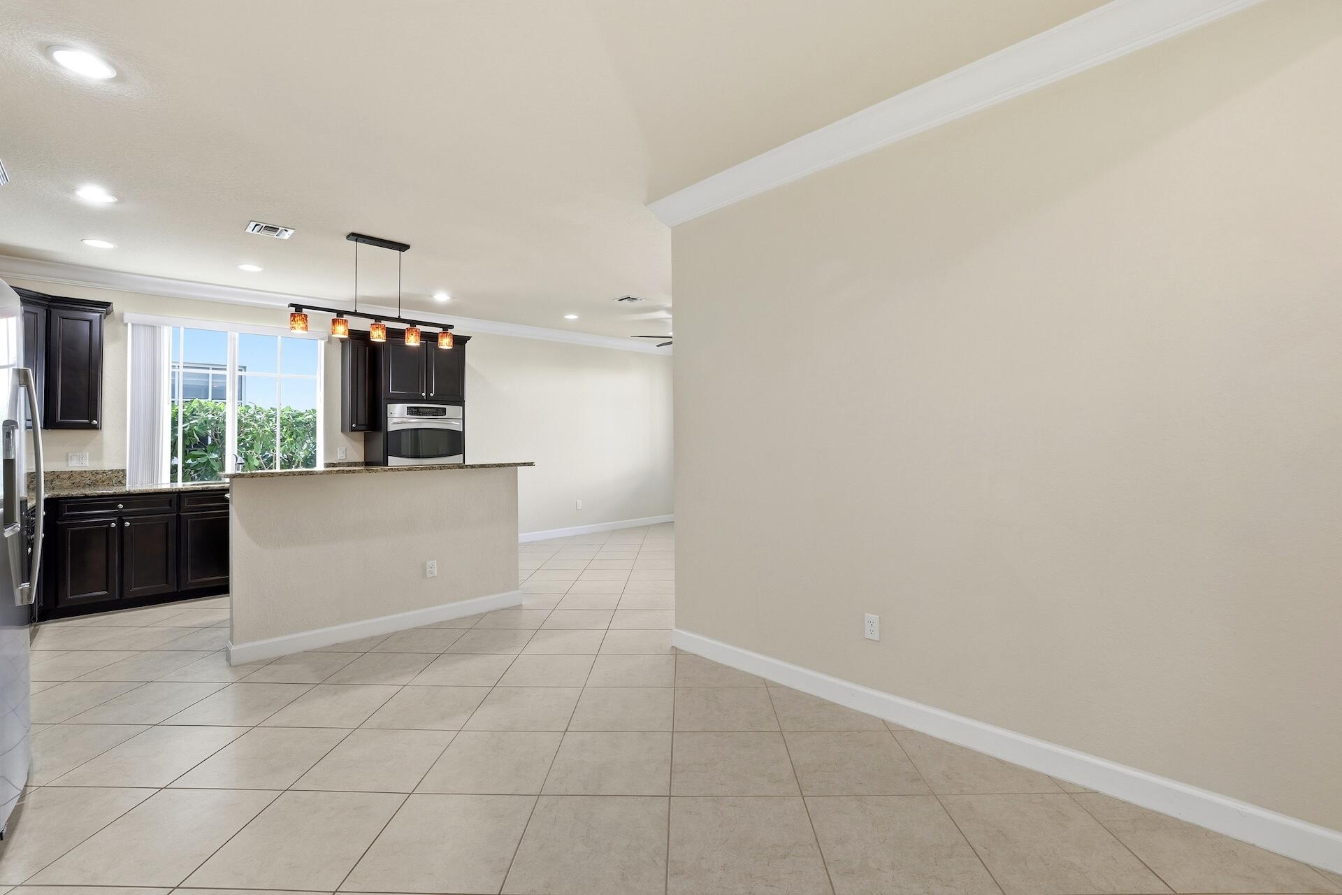 148 Northwest Emerson Place Boca Raton, FL 33432 - Photo 9 of 44 Looking toward Kitchen