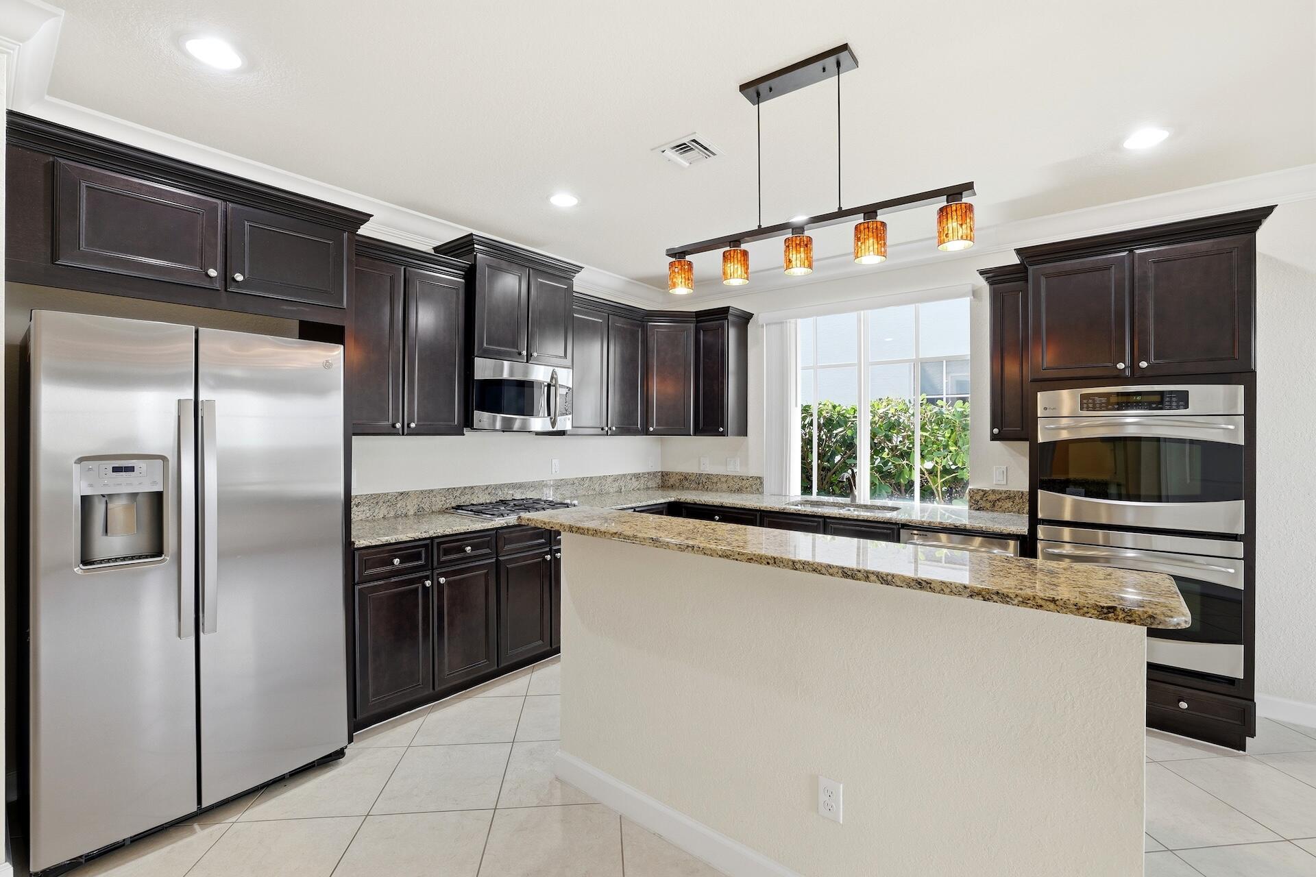148 Northwest Emerson Place Boca Raton, FL 33432 - Photo 10 of 44 Kitchen with Island