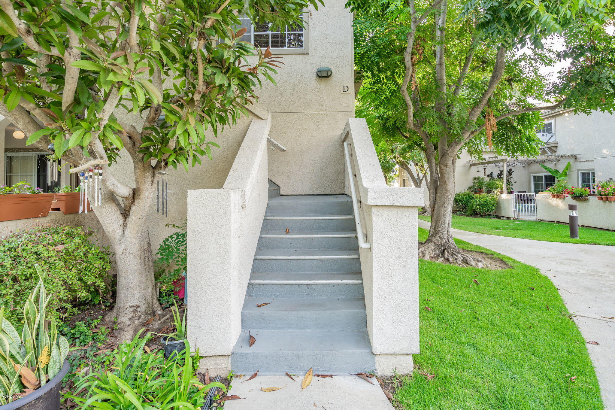 1067 Waltham Road, Unit D Simi Valley, CA 93065 - Photo 2 of 31 a view of yard along with trees
