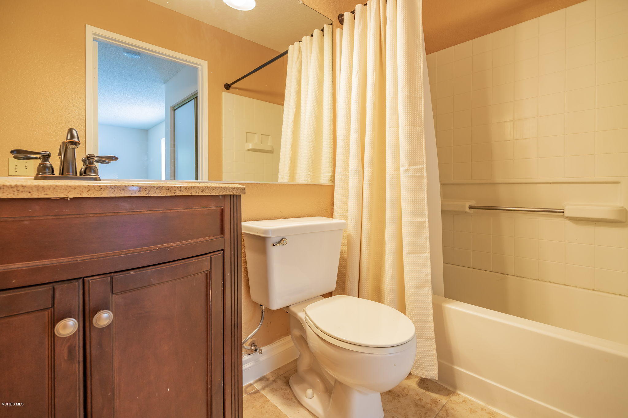 1067 Waltham Road, Unit D Simi Valley, CA 93065 - Photo 18 of 31 a bathroom with a toilet a sink and shower