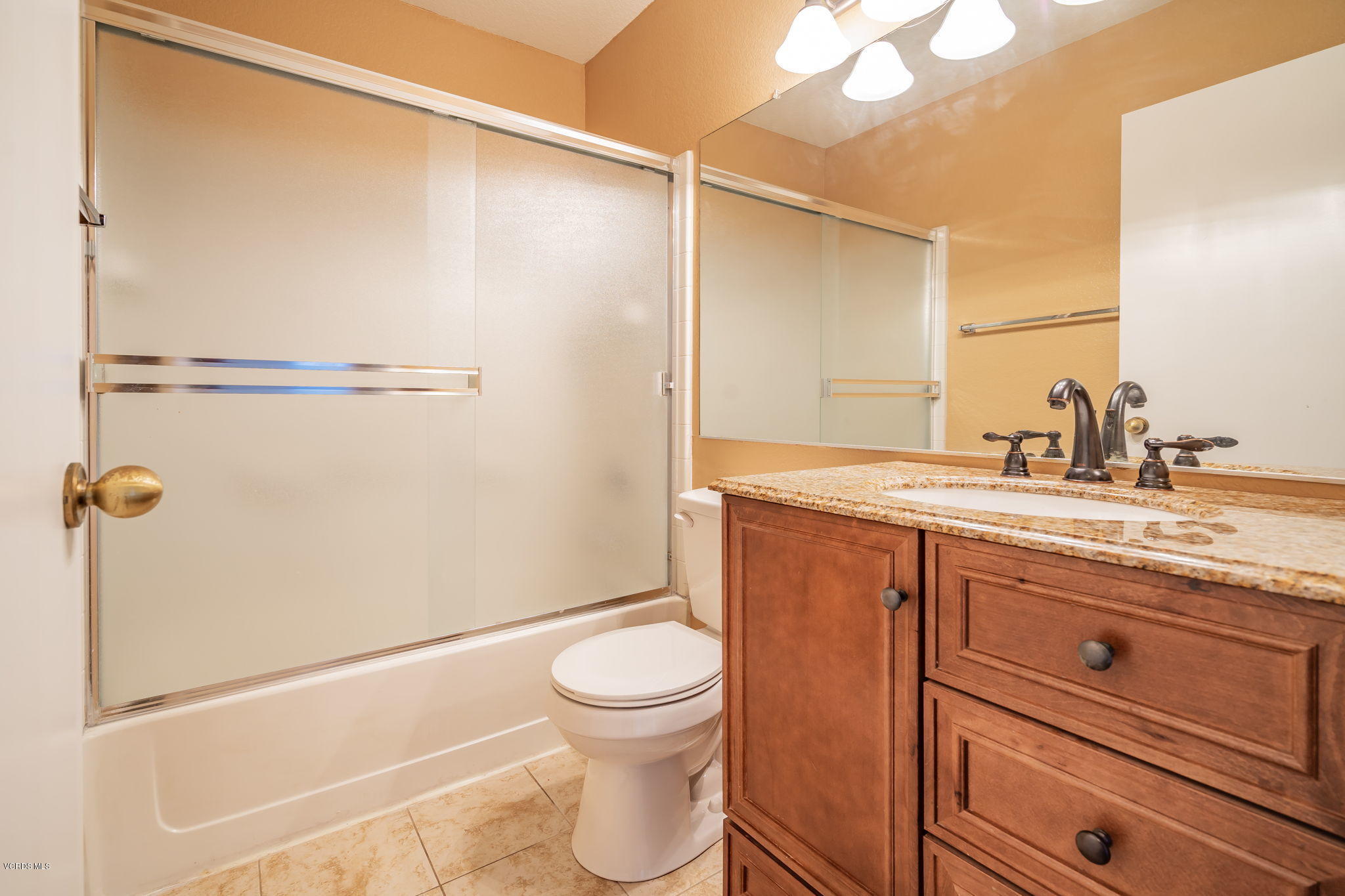 1067 Waltham Road, Unit D Simi Valley, CA 93065 - Photo 21 of 31 a bathroom with a granite countertop sink toilet and shower
