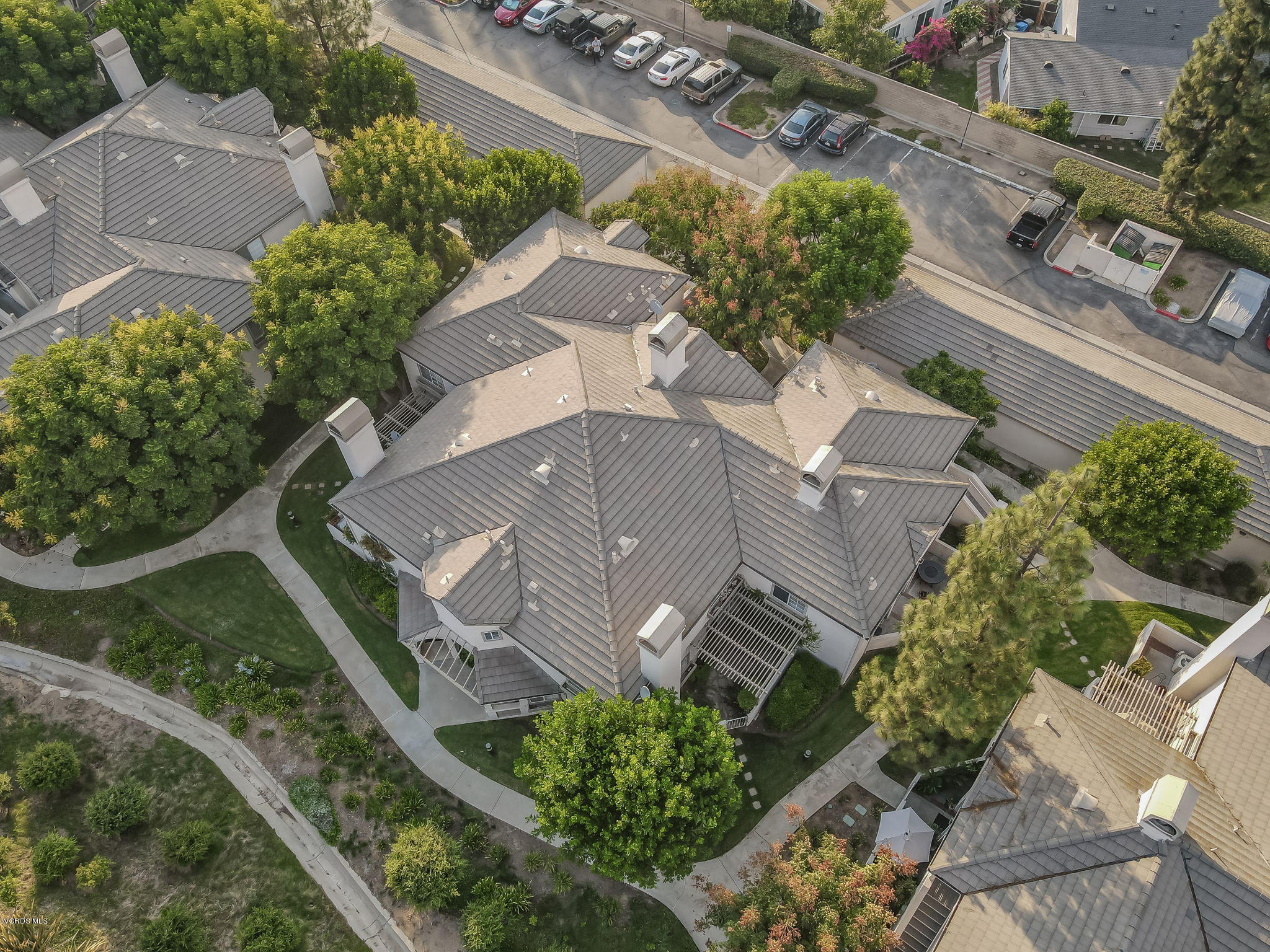 1067 Waltham Road, Unit D Simi Valley, CA 93065 - Photo 31 of 31 an aerial view of a house with a yard and a lot of flower plants