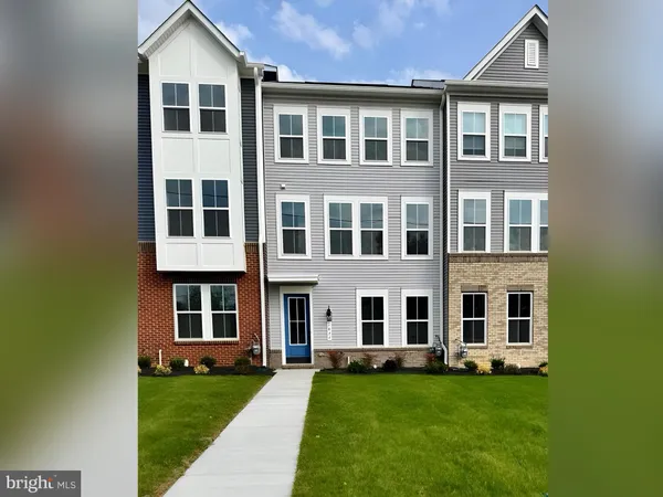 a big yard with large windows and a yard
