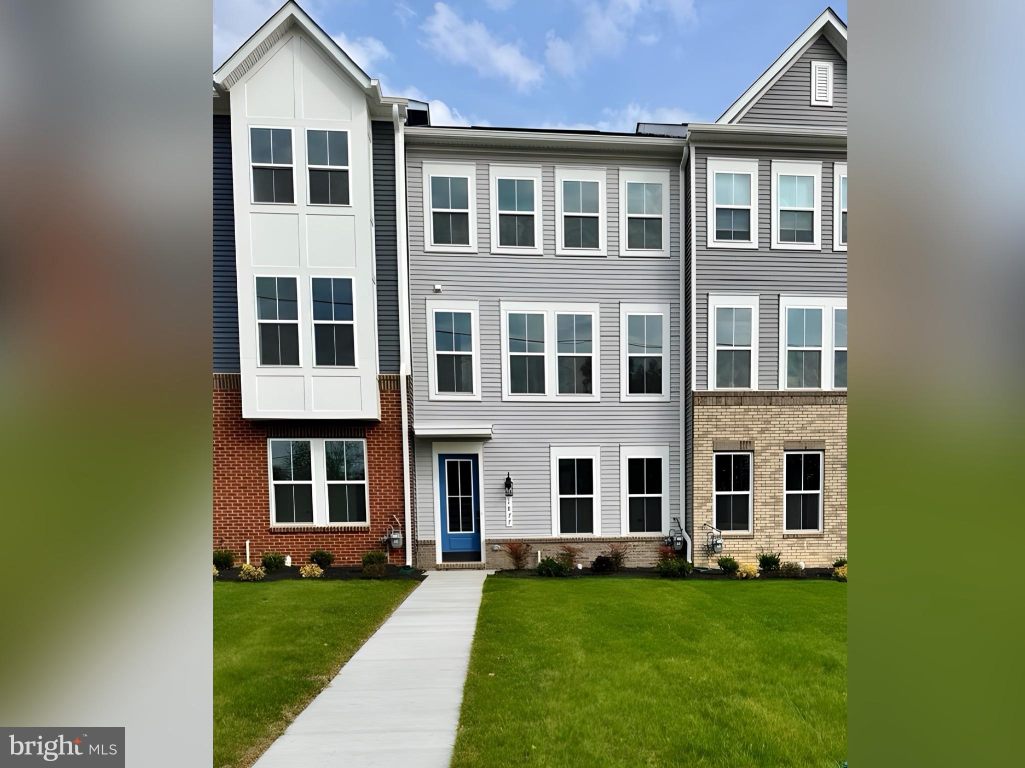 1877 Shookstown Road, Unit C Frederick, MD 21702 - Photo 1 of 5 a big yard with large windows and a yard
