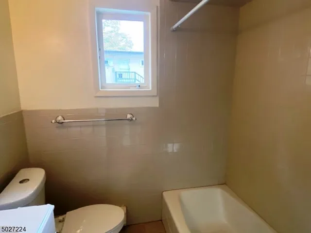 a bathroom with a toilet and a sink