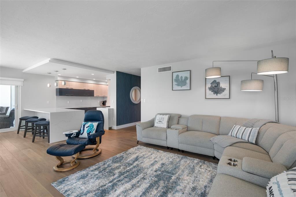 1050 Longboat Club Road, Unit 901 Longboat Key, FL 34228 - Photo 5 of 37 a living room with furniture and a wooden floor
