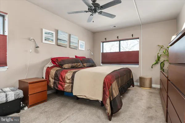 a bedroom with bed and window