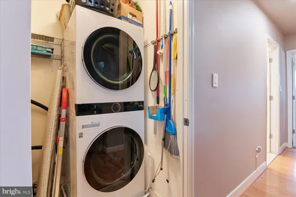 a view of a hallway with washer and dryer