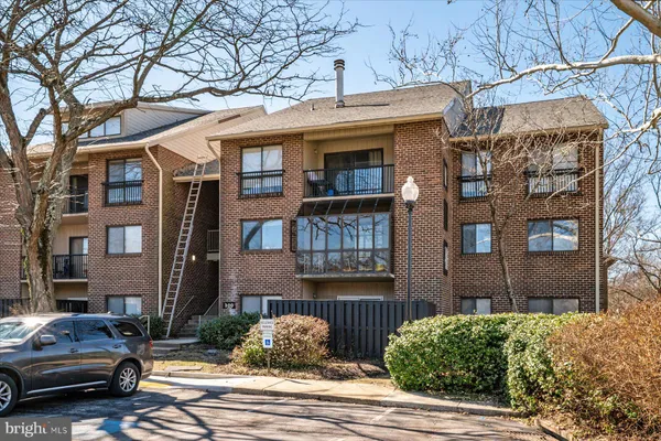 a view of a car parked on the side of a street