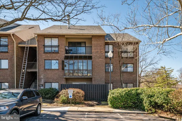 a front view of a house with parking