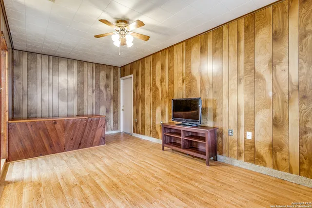 a view of livingroom with furniture and workspace
