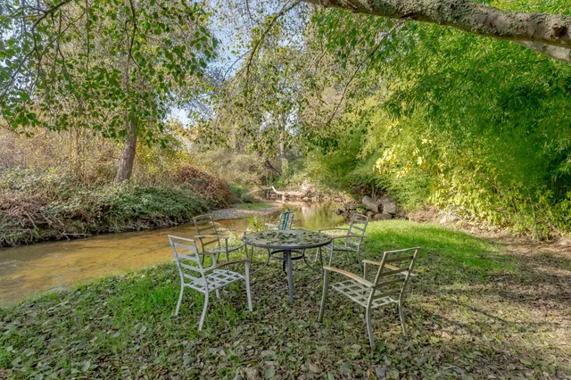 a bedroom with a large bed and a large window