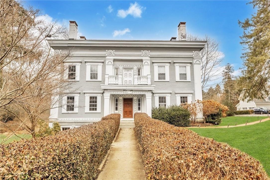 front view of a house with a yard