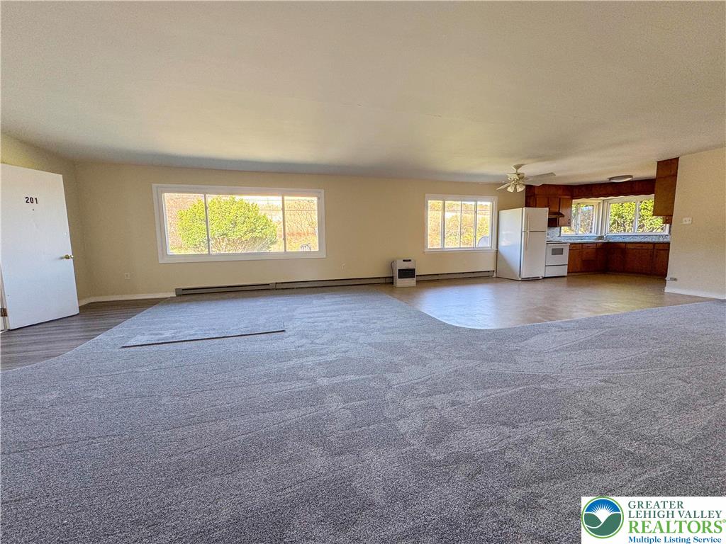 1350 Kunkletown Road, Unit 201 Saylorsburg, PA 18353 - Photo 3 of 15 a view of an empty room with a window